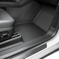 Tesla Model Y Juniper passenger floor mat with door sill protection — CabinProtect TPE liner
